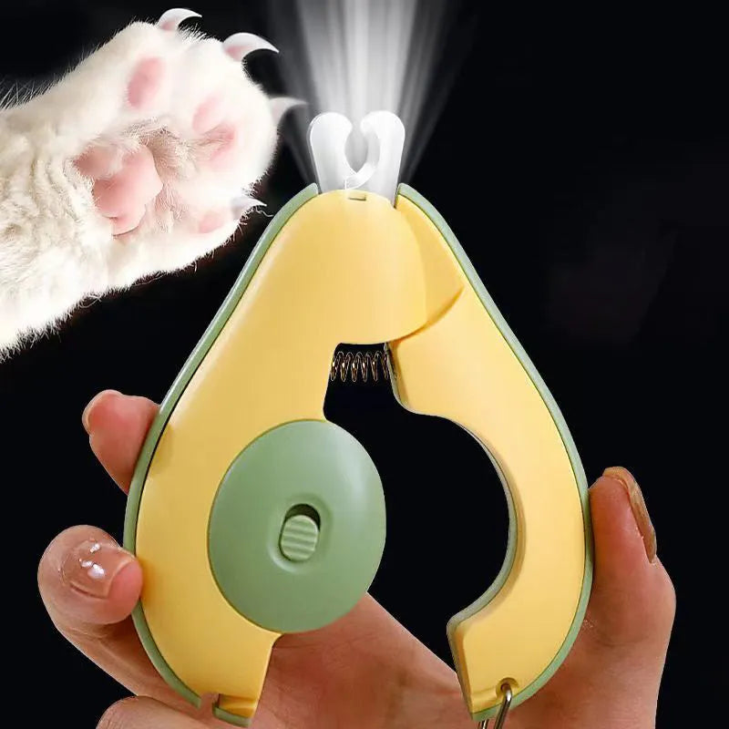 Green professional pet nail clipper with LED light on, showing safety guard and ergonomic handle.