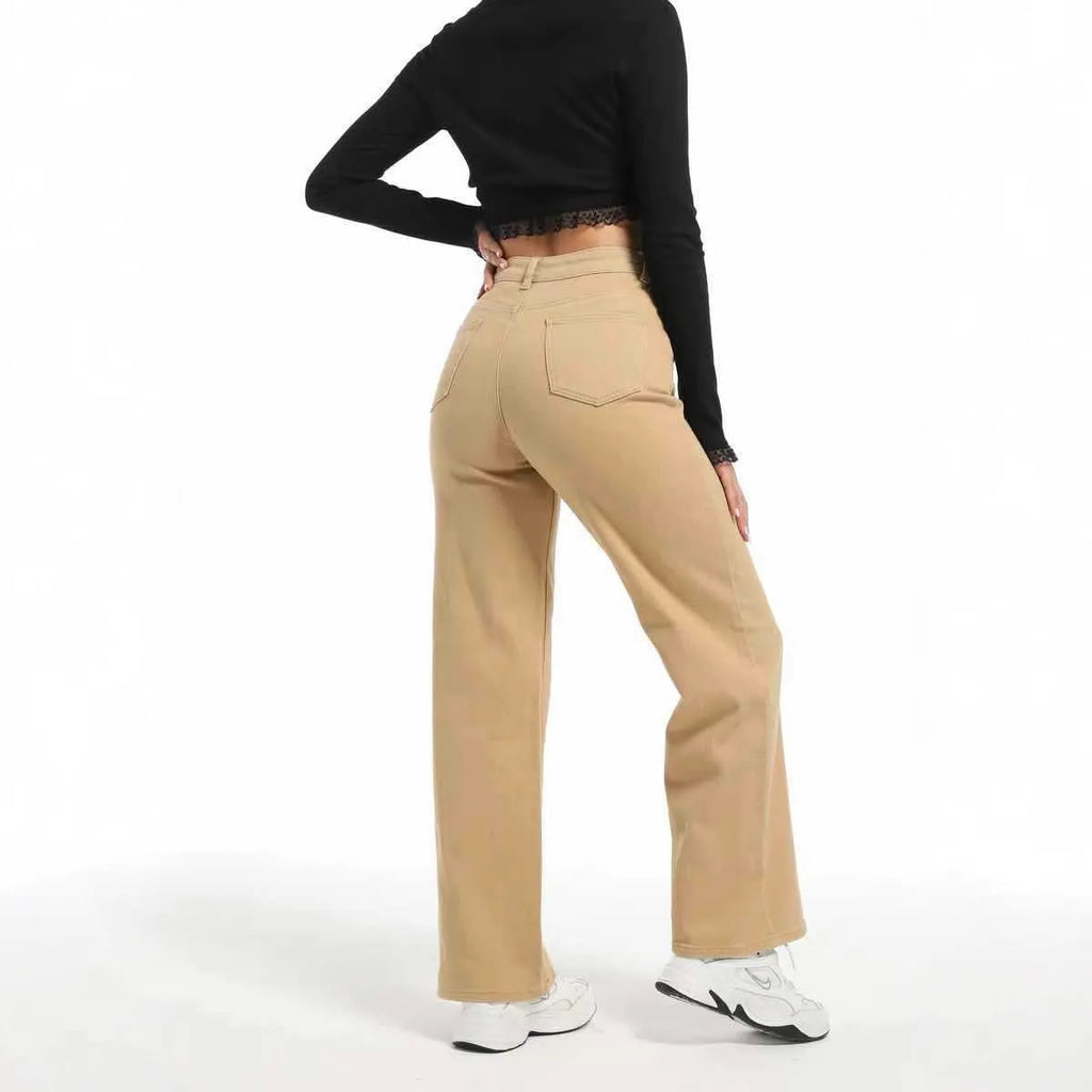 Women's high waist wide leg jeans in apricot colour on a hanger.