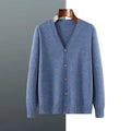 Man wearing a beige loose-fit V-neck Andy velvet knitted cardigan coat with long sleeves.