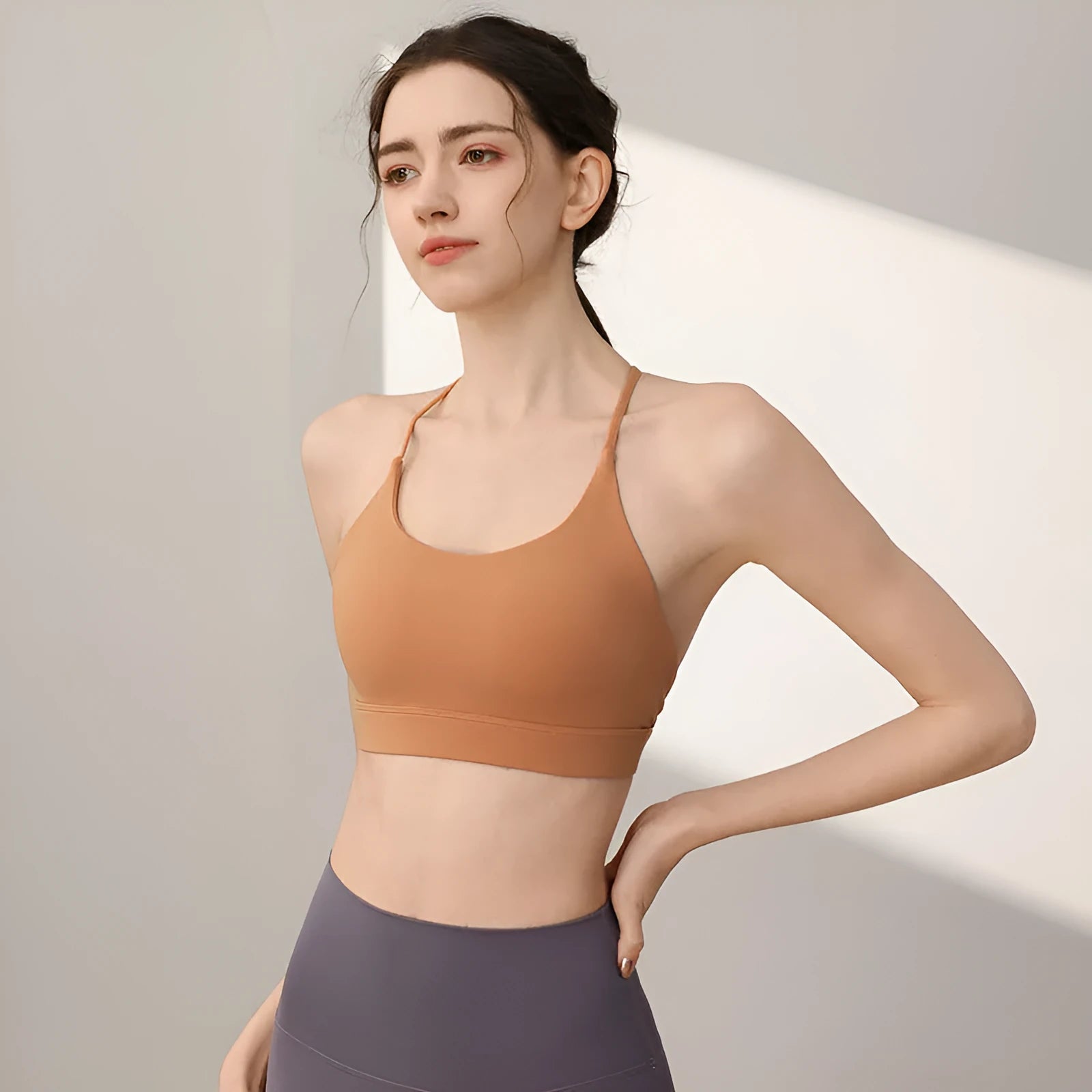 Women's nylon sports vest in green tea green colour with fixed double shoulder straps.