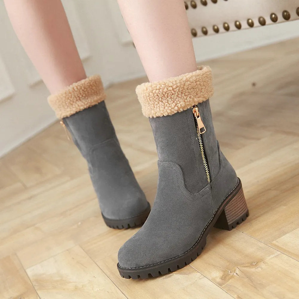A pair of snow boots with a rubber outsole and plush lining in one of four colours: black, grey, green, or orange.