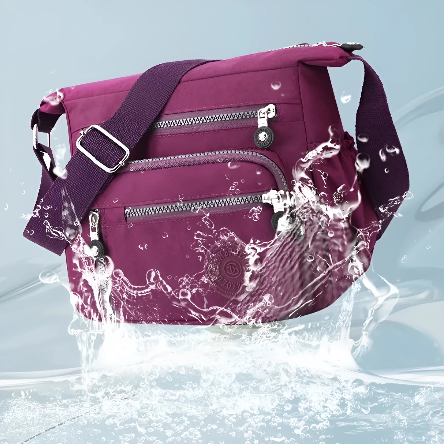 Soft nylon shoulder messenger bag in a square vertical shape with a single strap.