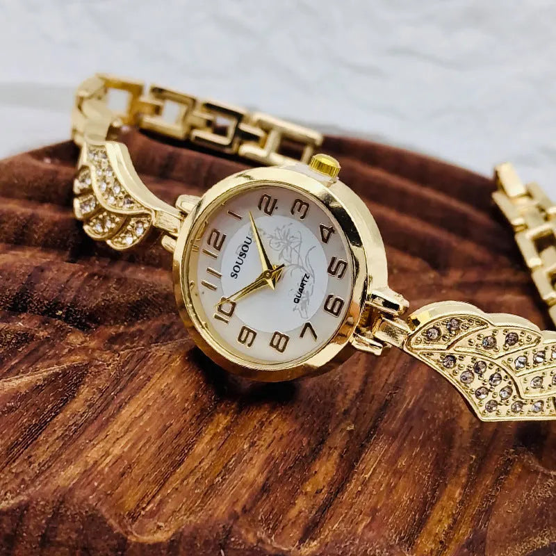 Women's stainless steel watch with round dial and Vachette clasp buckle showing gold face option