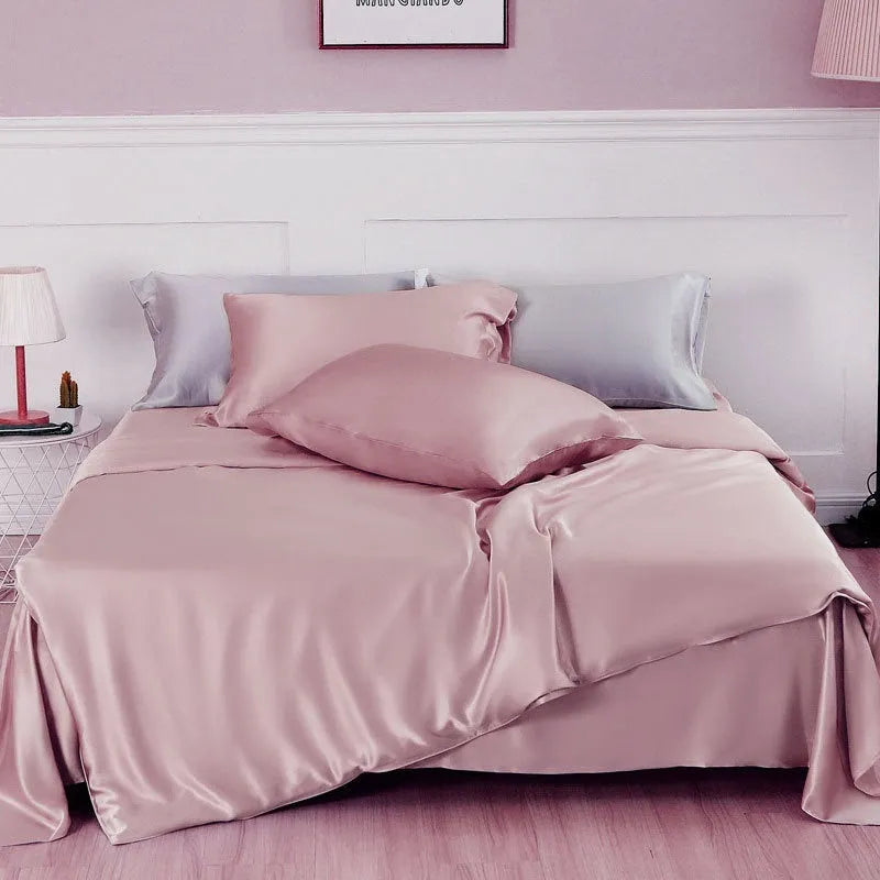 Double-sided solid colour silk duvet cover shown in Lotus Pink, pea green, bright brown, purple, white, or blue.