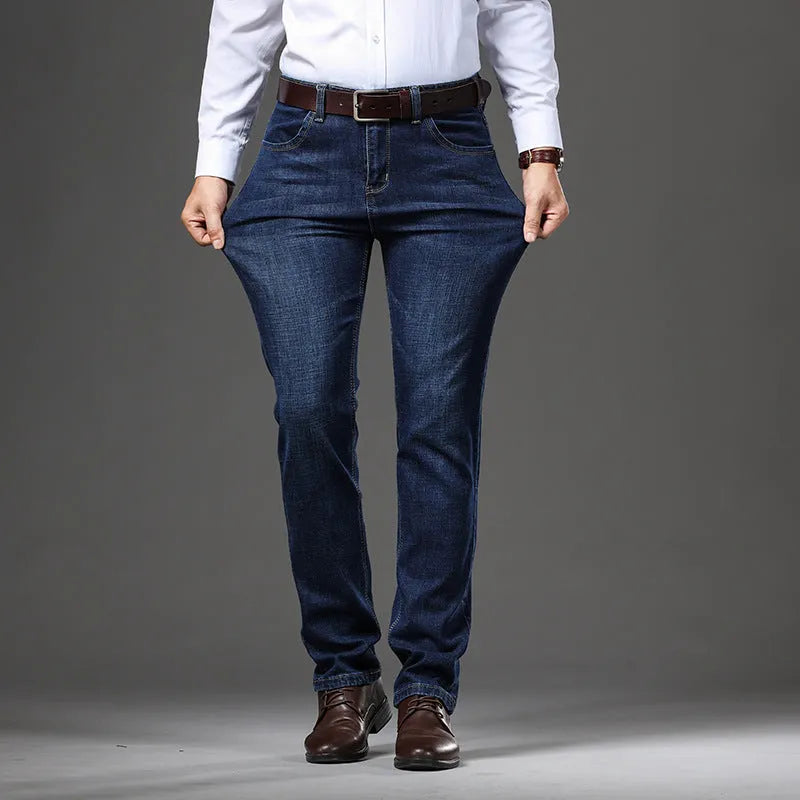 Women's loose fit black stretch jeans with a straight leg and zip fly, shown on a hanger.