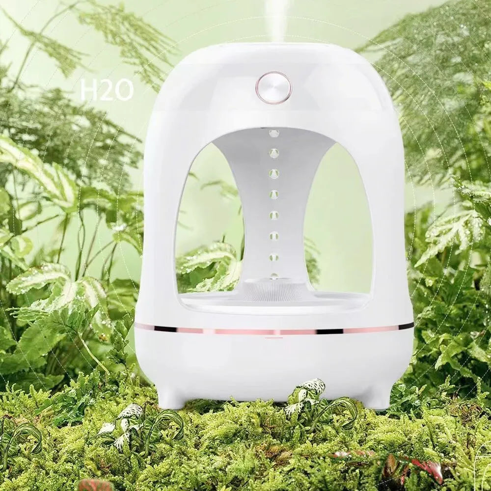 Anti gravity levitating water drops ultrasonic humidifier with LED night light in rose gold and white colour on a desk