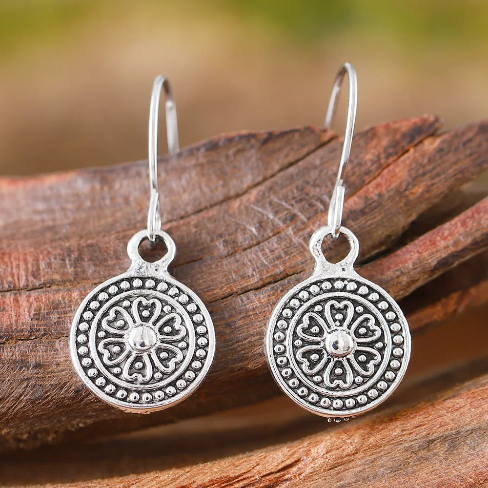 Bohemian style geometric round earrings with distressed ethnic print and retro electroplated finish