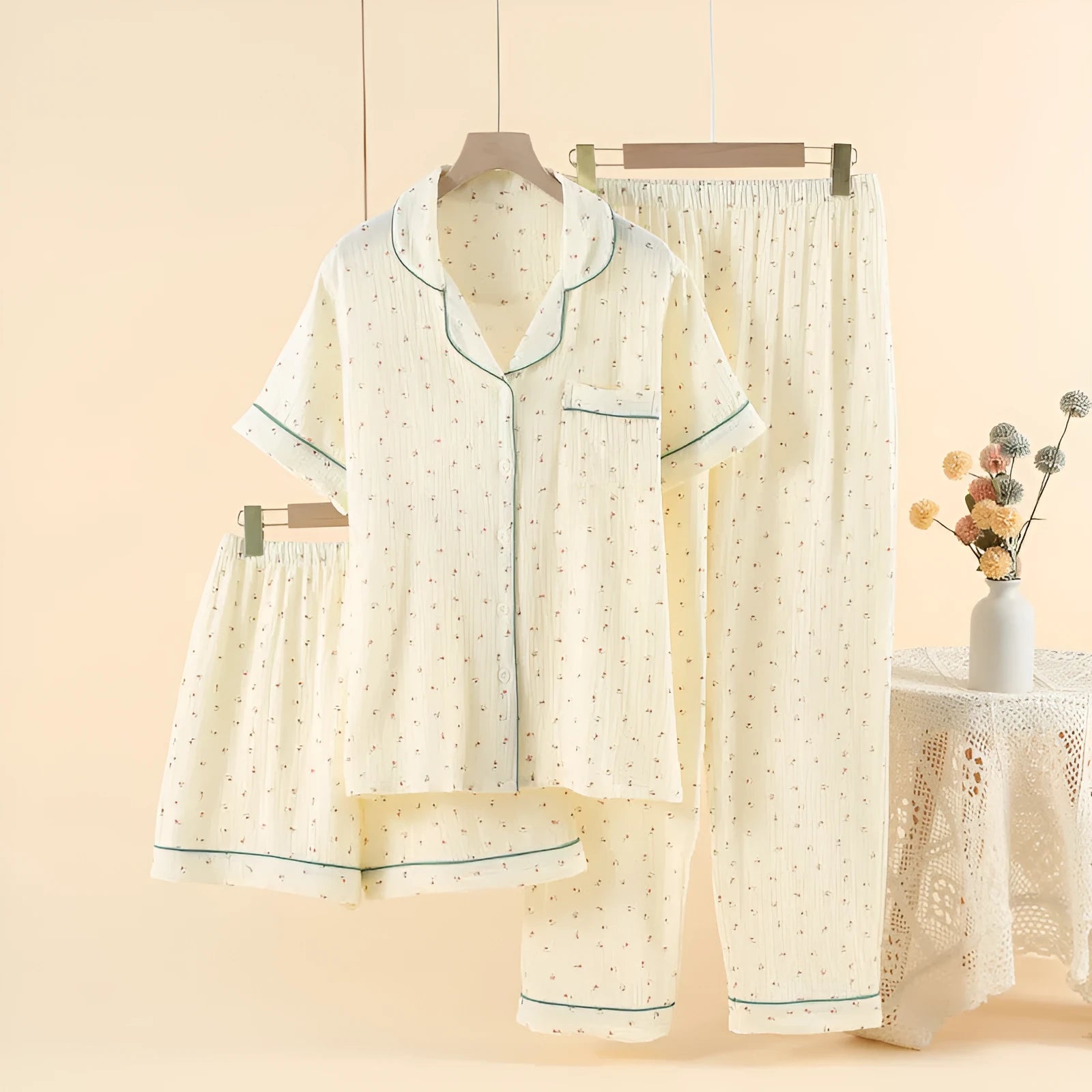 Women's garden gold cotton three-piece pajama set with lapel neckline and three-quarter sleeves.