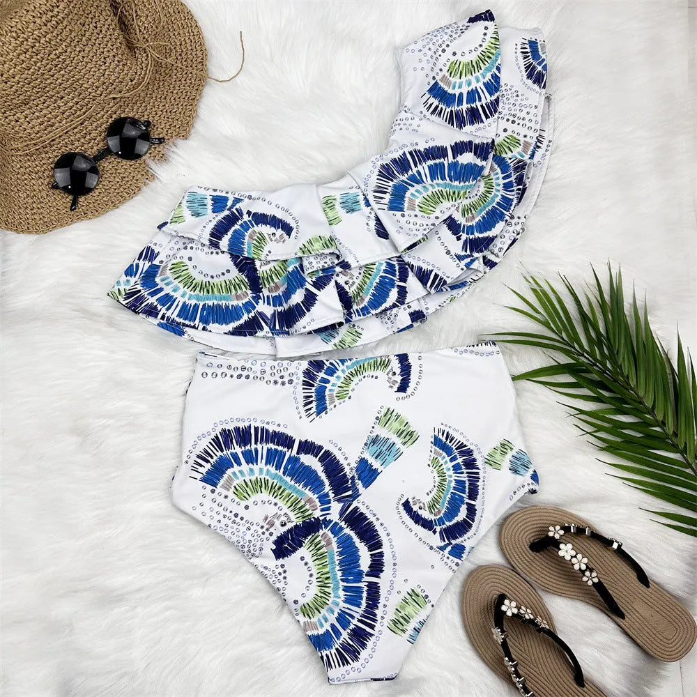 White women's one-shoulder swimsuit with lotus leaf design and thigh split