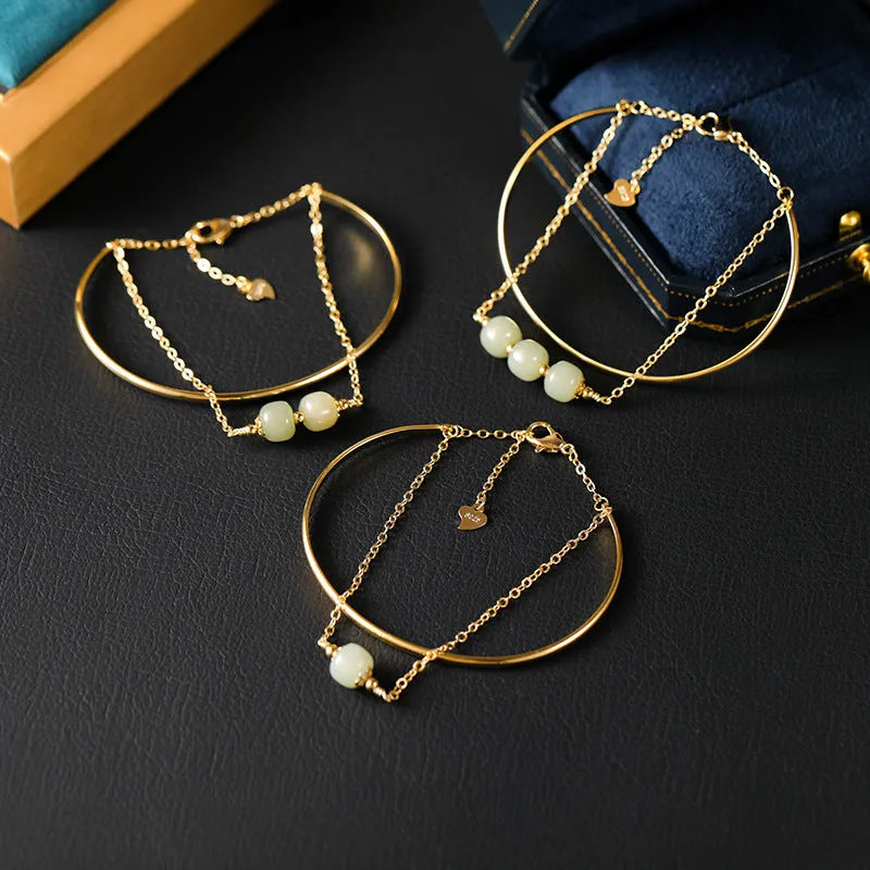 Hetian jade lucky beads bracelet with gold inlay, shown in women's fake two pieces style.