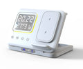 Black 5-in-1 wireless charging dock station showing phone, watch, and earbuds charging next to LED digital clock display.