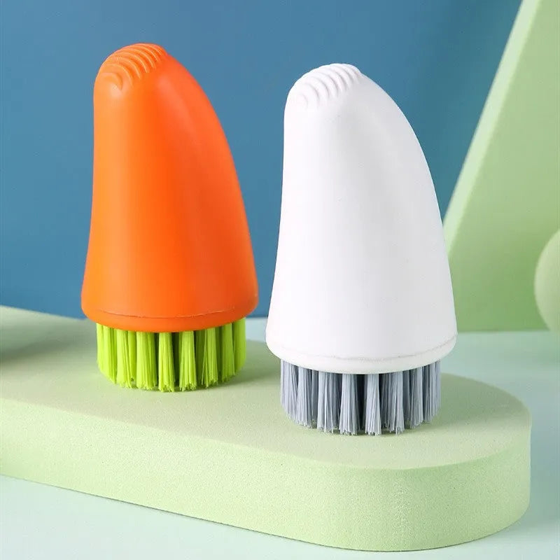 Multifunctional carrot-shaped kitchen brush with nylon bristles in orange and white colours