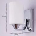 Chrome electroplated wall lamp with glass shade showing single head bedside lighting fixture