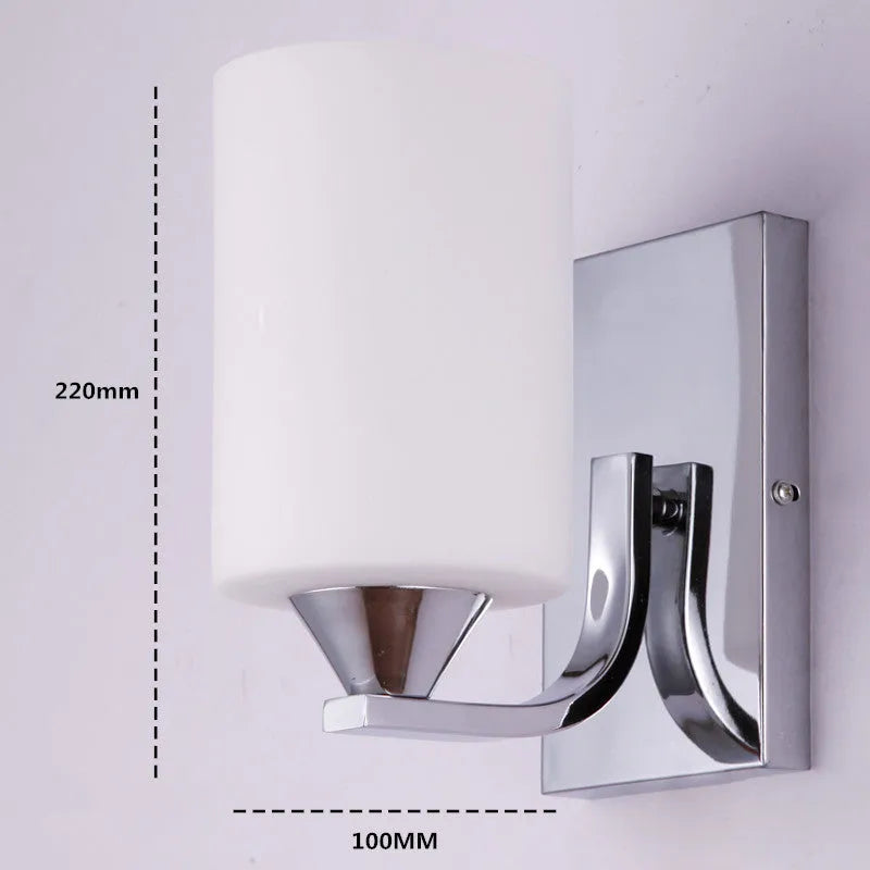 Chrome electroplated wall lamp with glass shade showing single head bedside lighting fixture