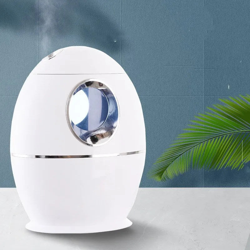 White columnar household mute air disinfection humidifier with single fog outlet on a wooden table