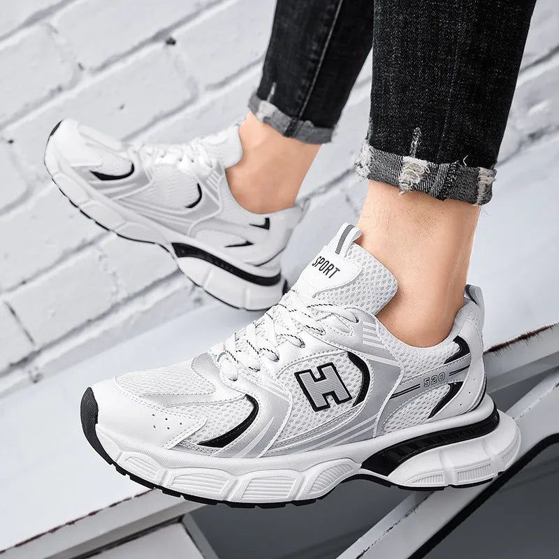 Men's white and gray mesh casual running shoes with a round toe and injection moulded plastic sole.
