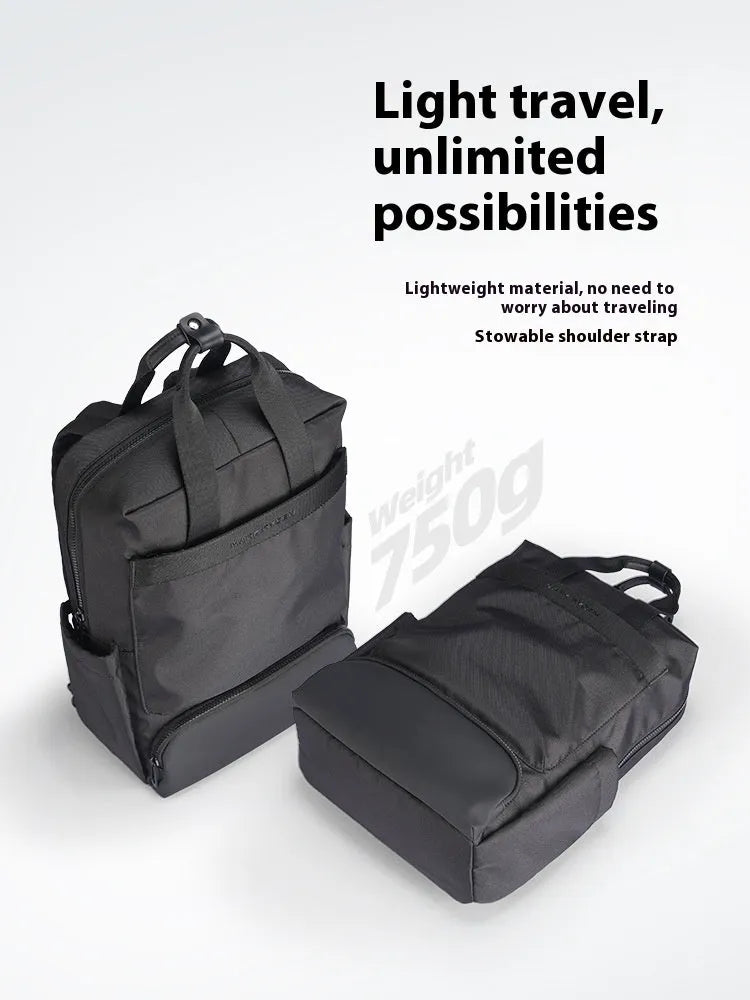 Black Oxford cloth computer backpack showing laptop compartment and storage organisation