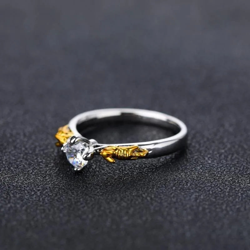 Copper crown crystal ring with black gold finish showing sizing options