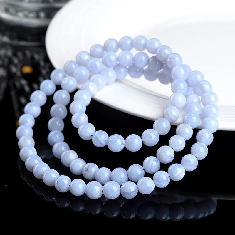 Blue striped agate bracelet with scattered beads showing multi-circle pattern