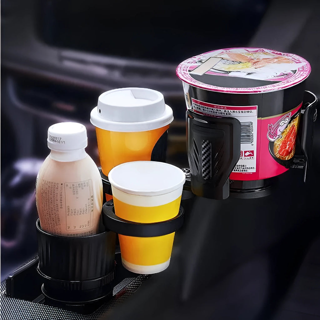 Black retractable car water cup holder with adjustable base on a car centre console.
