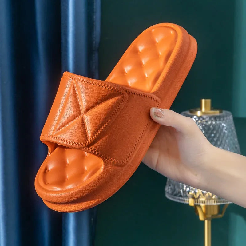 Pair of EVA bathroom slippers with thick non-slip sole shown in colour options.