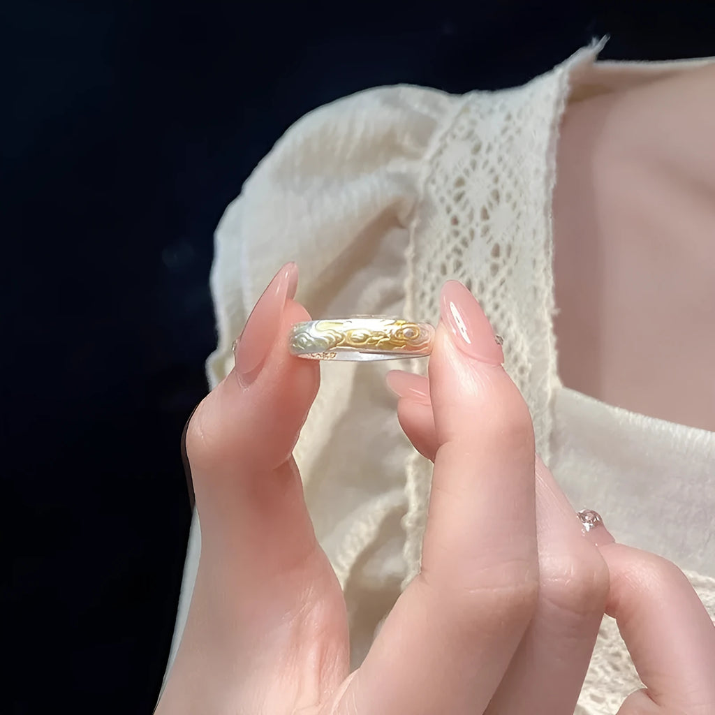 Geometric white copper open ring with silver and gold electroplated Xiangyun pattern.