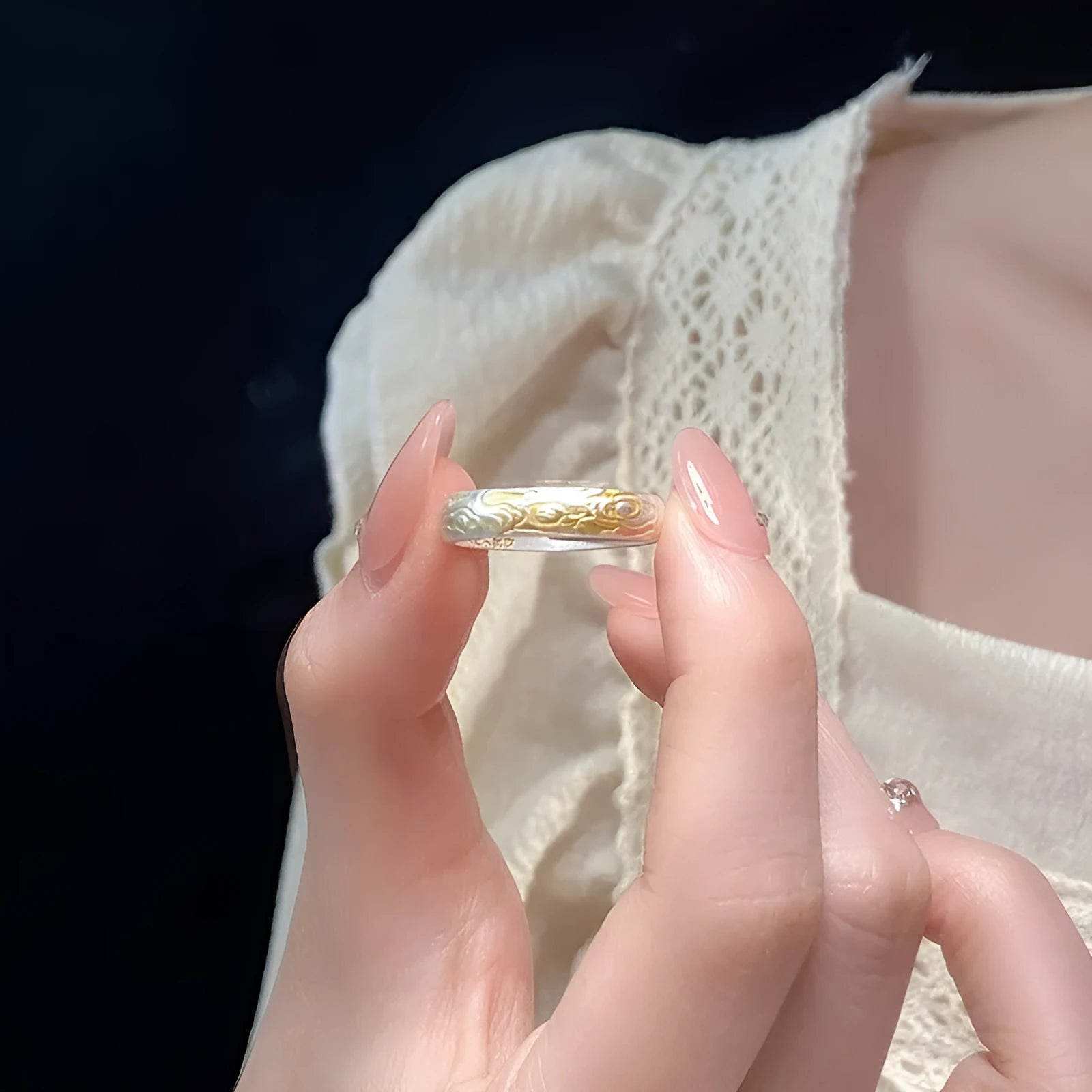 Geometric white copper open ring with silver and gold electroplated Xiangyun pattern.