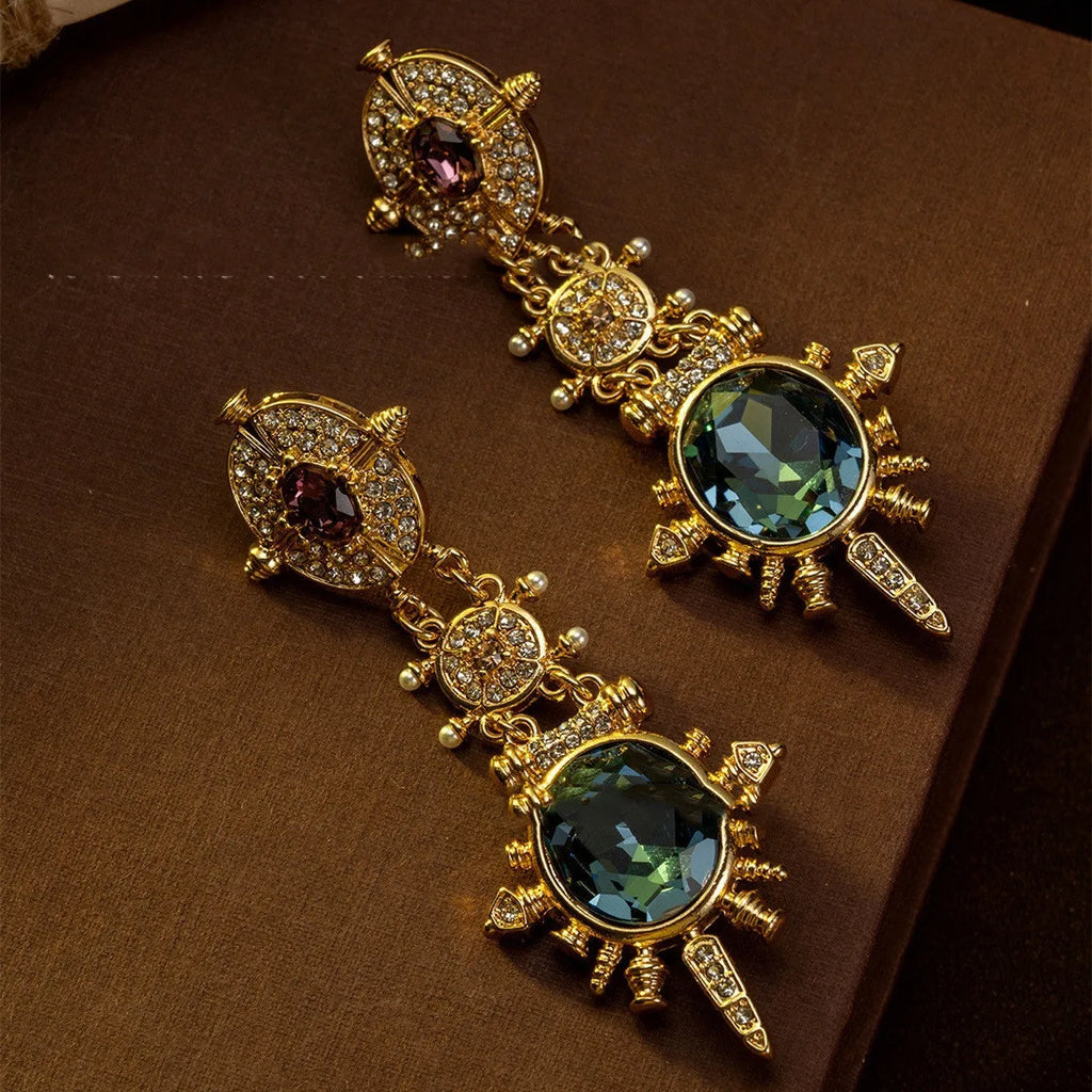 A pair of gold colour alloy stud earrings with geometric round shape in retro court style