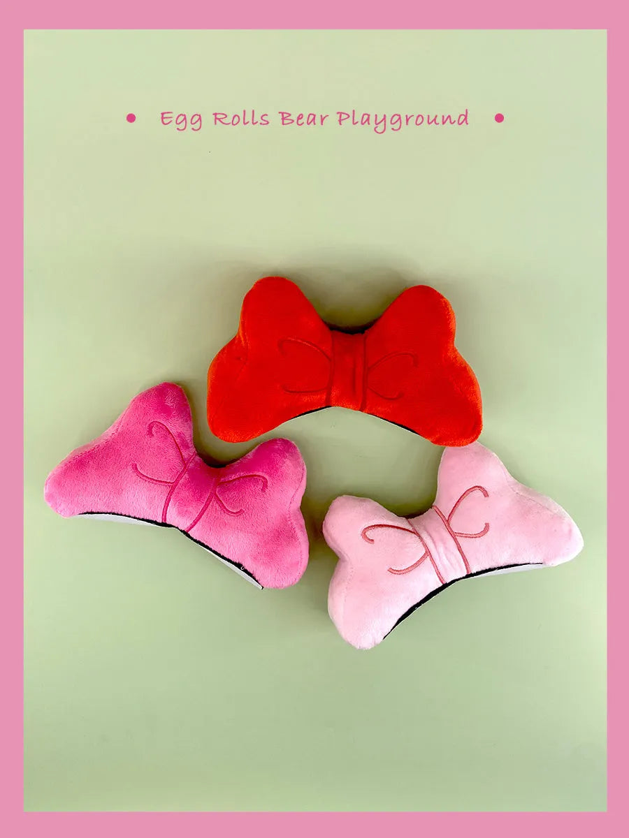 Plush bow helmet decoration in red, peach pink and rose pink colours for motorcycle and ski helmets