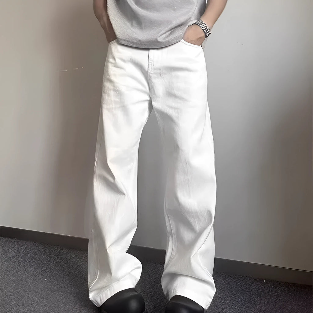 Men's white straight-leg wide fit cotton denim jeans on a neutral background.