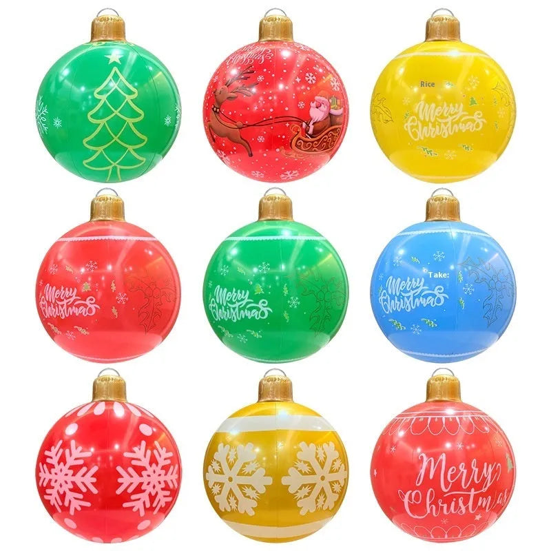 Large red and white inflatable Christmas ball with flashing lights displayed in outdoor garden setting