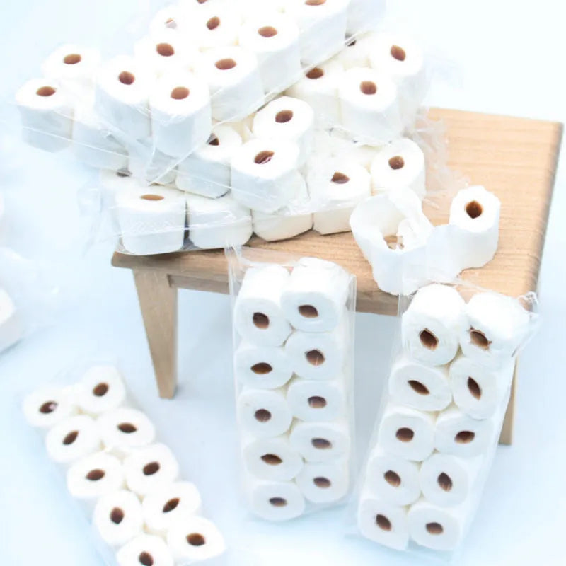 Miniature simulated paper toilet paper roll model for childrens play, dimensions 30mm by 15mm by 80mm.