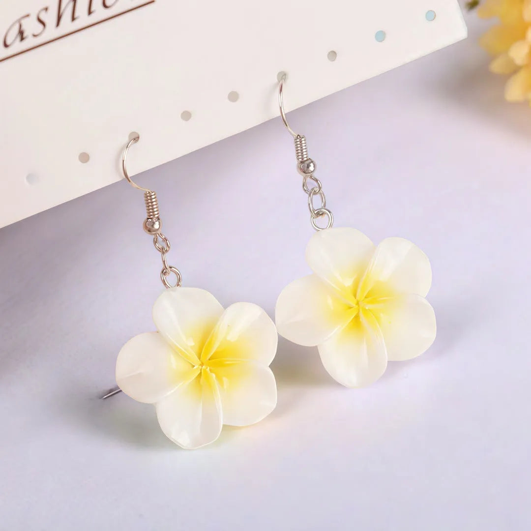 Handmade Plumeria Rubra resin earrings in eight colours including blue and pink, lightweight floral design for pierced ears