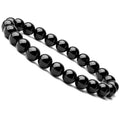 Women's black onyx agate beaded bracelet with geometric design and elastic cord.