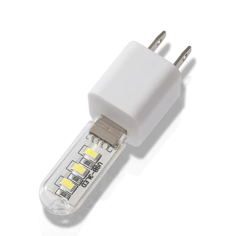 Compact LED night light with USB cable showing white and warm light colour options