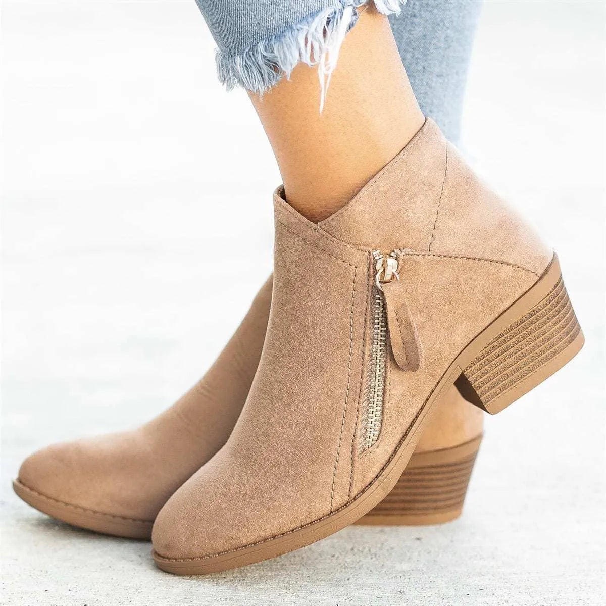 Blue women's suede ankle boots with a side zipper closure and a lightweight composite sole.