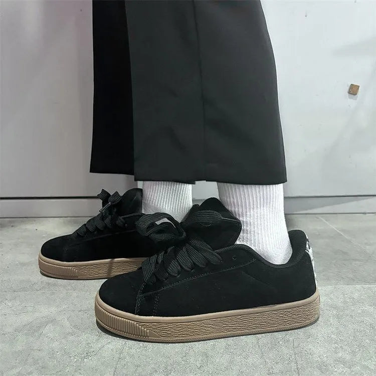 Black retro low-top sneakers with waterproof platform, round toe, and lace-up closure for men and women