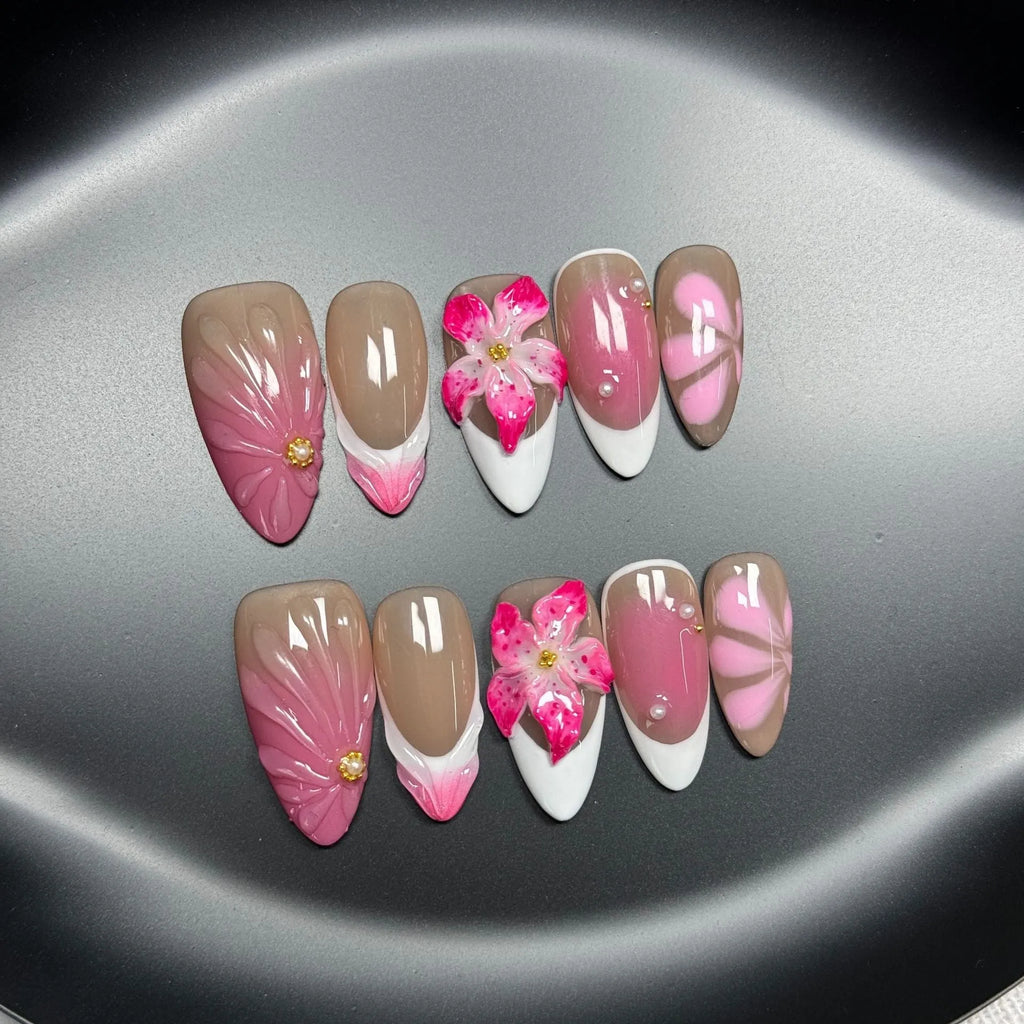 Plastic French style artificial nails with 3D lily and ice flower designs in almond shape, shown in multiple sizes.