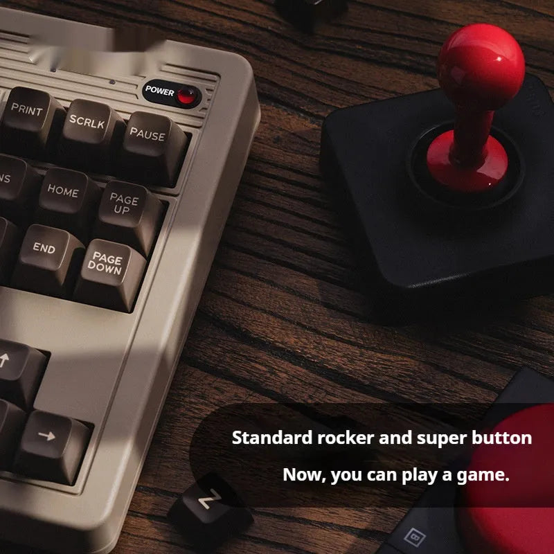 Retro87 C64 wireless Bluetooth mechanical gaming keyboard with rocker control on desk
