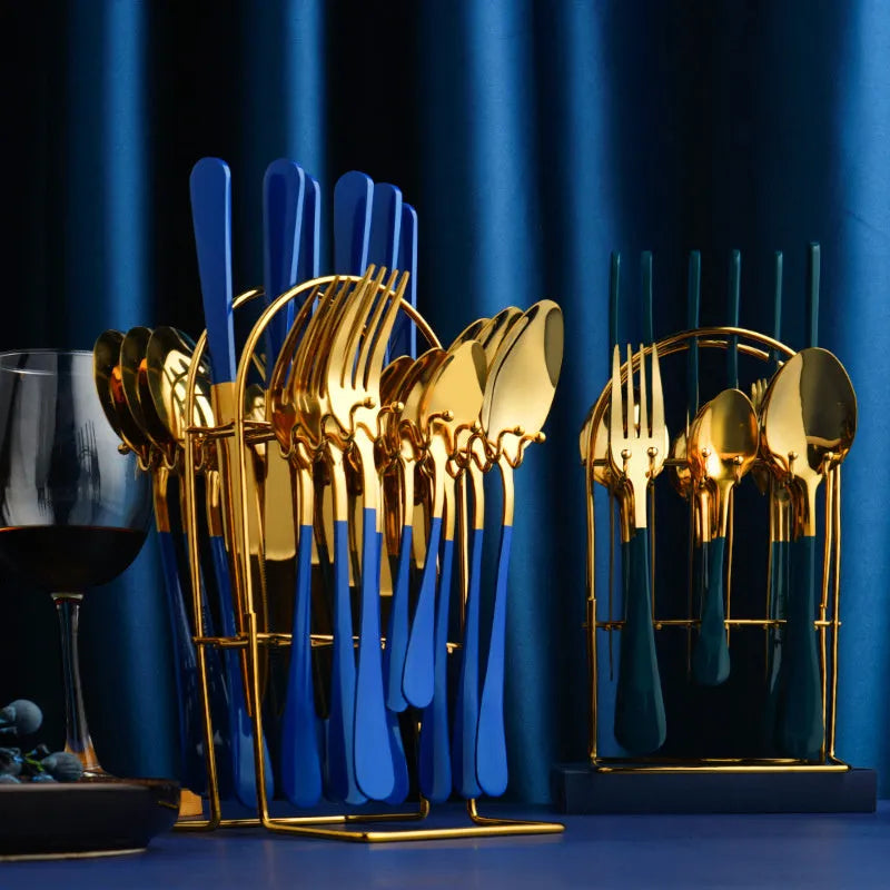 Gold stainless steel 24 piece dinnerware set with storage rack knife fork spoon on white background