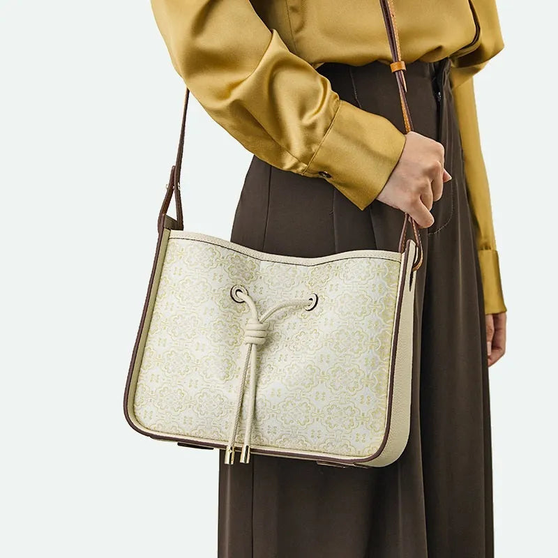 Light luxury genuine leather underarm bag in bucket shape, beige, with three-dimensional outer pocket on front