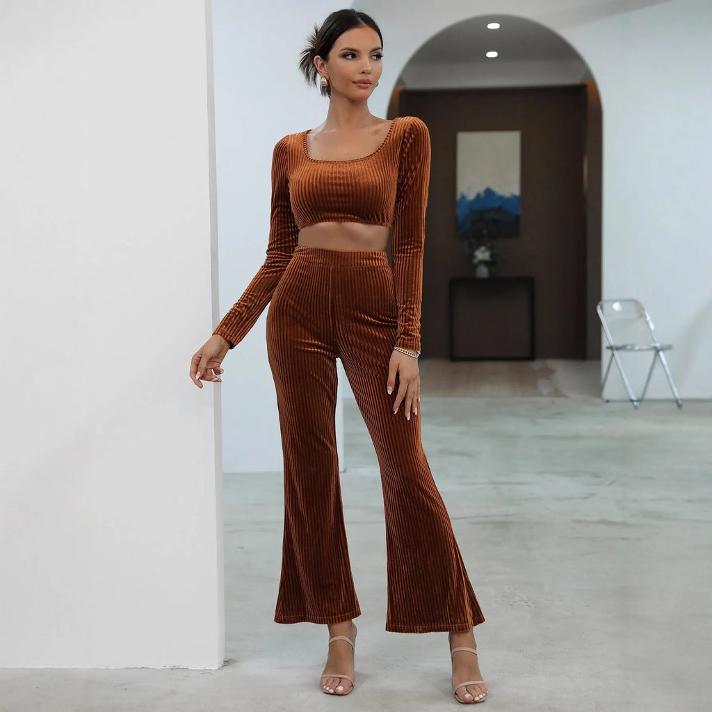 Caramel coloured long sleeve sweater and trousers casual set on a hanger.