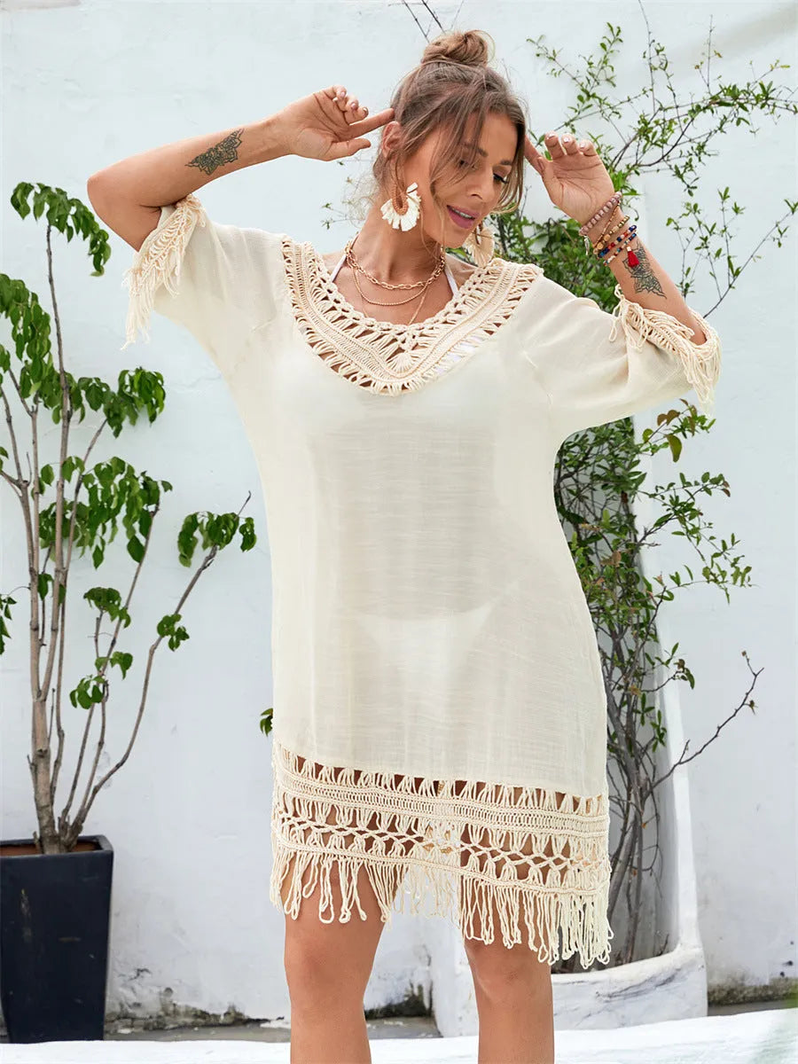 Apricot coloured hand-crocheted women's beach dress with lining on a mannequin