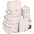 Eight cubic travel packing bags in various solid colours for underwear and daily supplies organisation