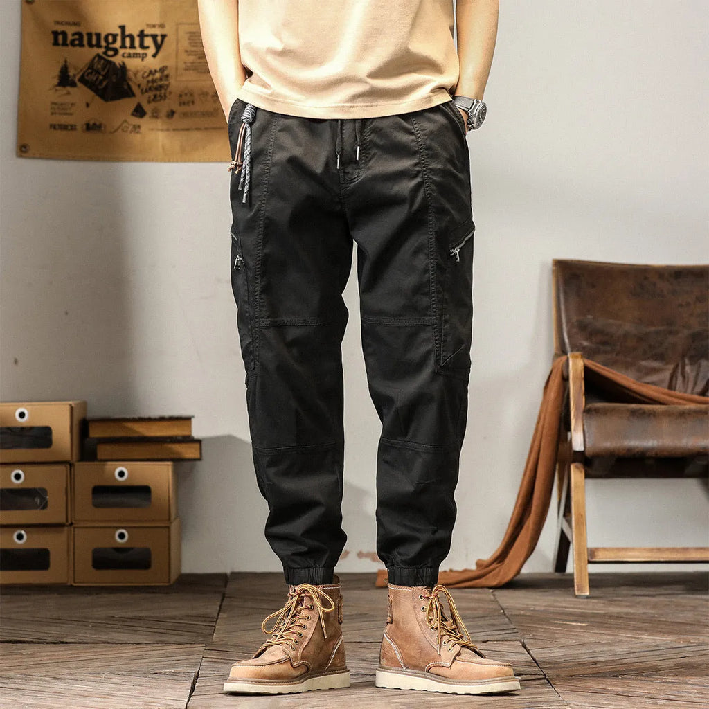 Men's cotton tapered harem pants in black colour with ankle bands and zip fly