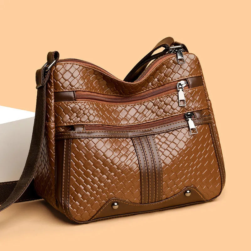 Multi-compartment woven PU messenger bag in brown, horizontal shape with single shoulder strap