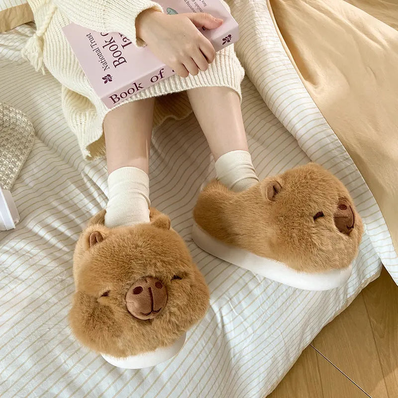 Light brown women's winter slippers with a cartoon pattern, plush upper, and wool lining.