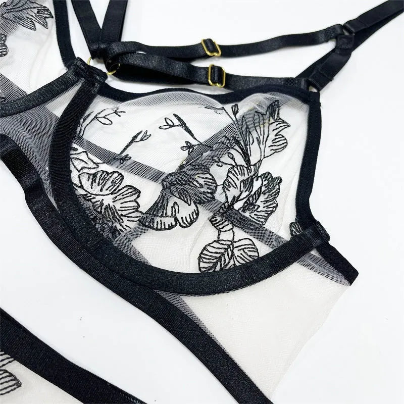 Women's black lace three-piece set with floral print showing top, pants and waist ring on hanger