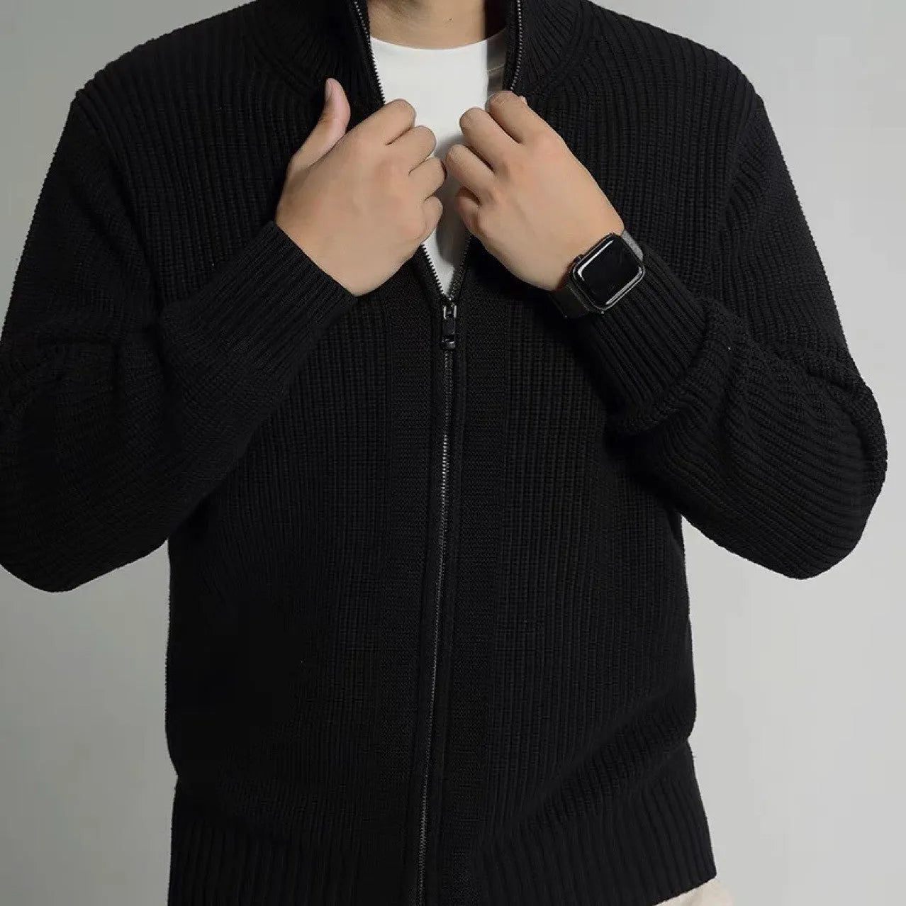 Men's loose fit black modal cardigan sweater on model, front view, size L