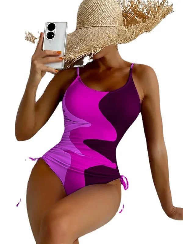 Women's sleeveless backless one-piece swimsuit in nylon spandex fabric available in blue, purple, brown, green colours